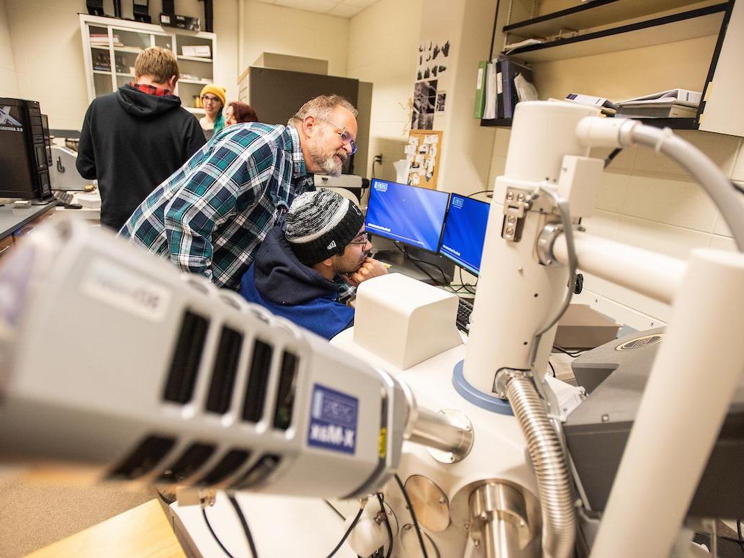 Student with microscope